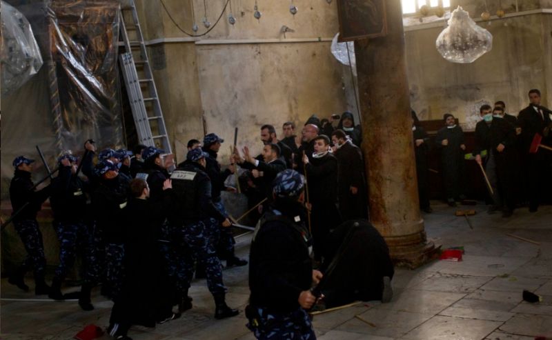 Christian clergymen celebrate Christmas by beating each other up at the Church of the Nativity in Bethlehem